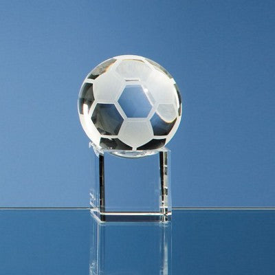 Branded Promotional 5CM OPTICAL GLASS FOOTBALL ON CLEAR TRANSPARENT BASE AWARD Award From Concept Incentives.